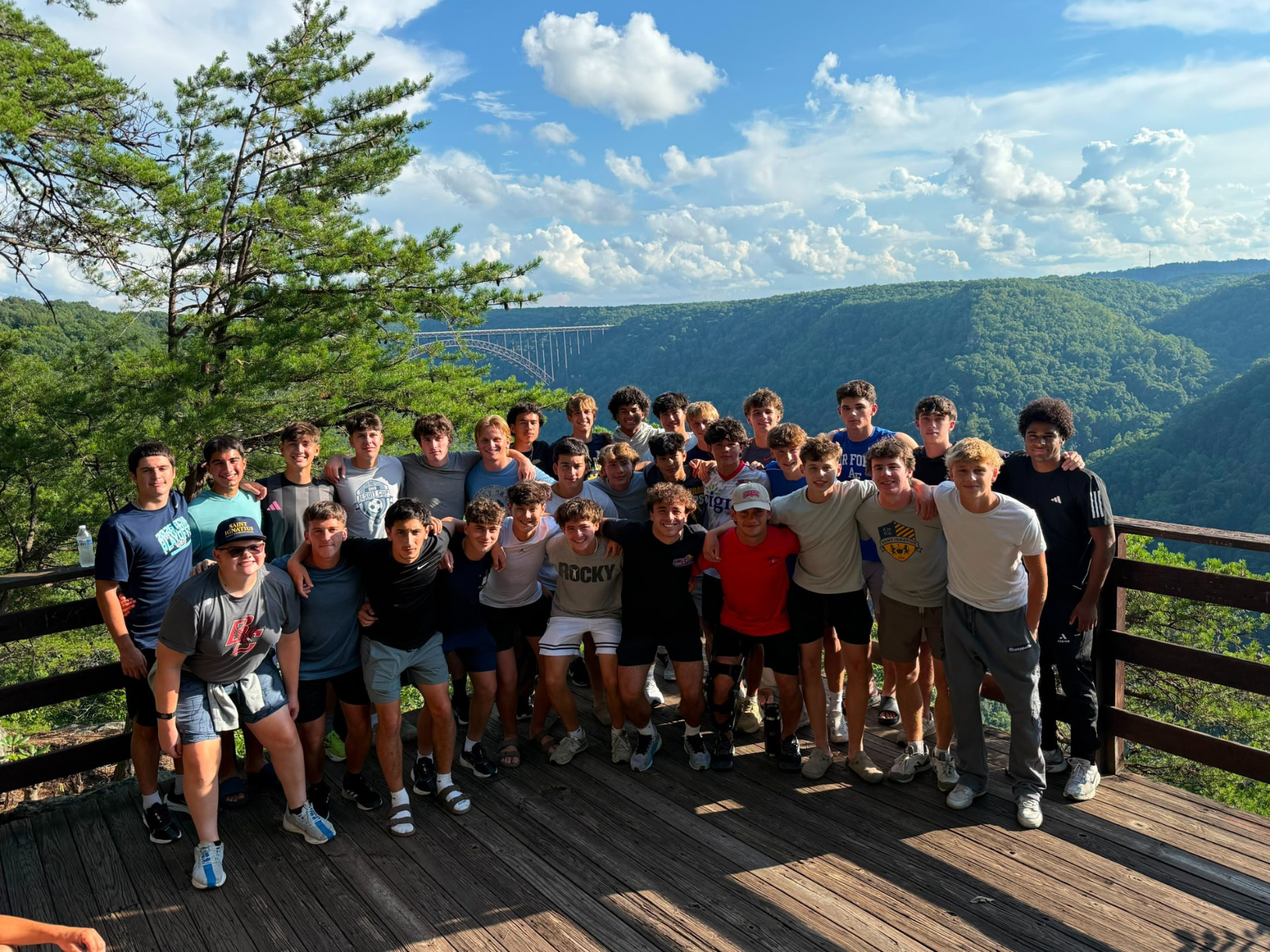 The 2026 St. Ignatius Wildcats soccer team on an overlook above the New River Gorge in West Virginia